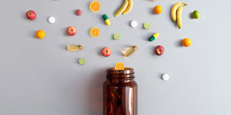 A bottle with fruit and pillsAI-generated content may be incorrect.