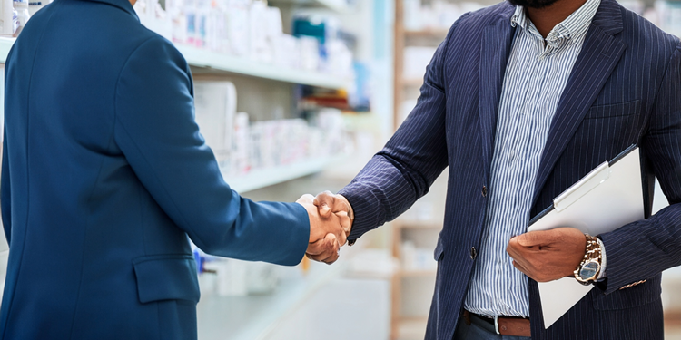 A close-up of people shaking handsAI-generated content may be incorrect.