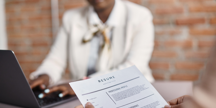 A person holding a paperAI-generated content may be incorrect.